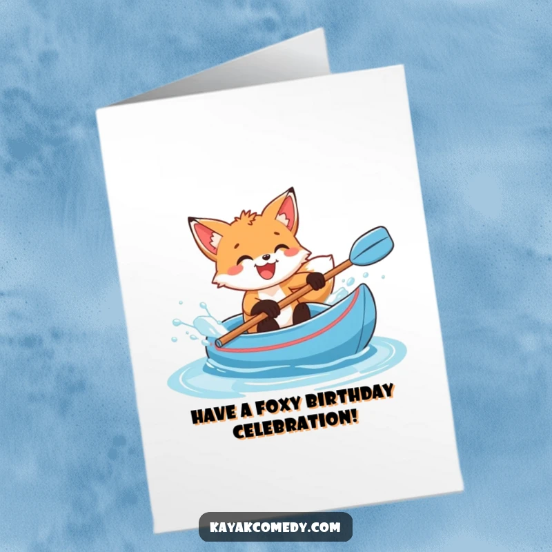 Funny Free Printable Birthday Card: Delighted fox cub splashing water with glee in a blue kayak, celebrating.