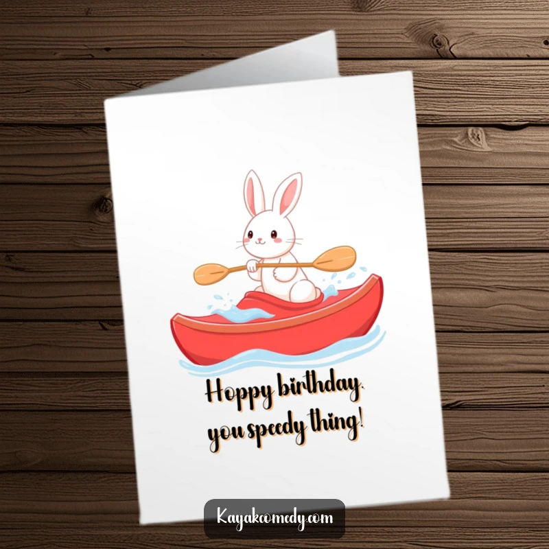Funny Free Printable Birthday Card: Playful rabbit steering a bright red kayak through gentle waves, celebrating.